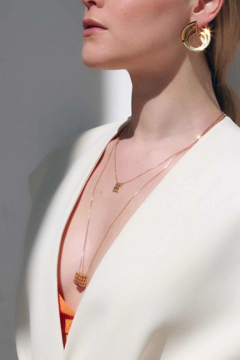 Orecchini vortex guggenheim e ciondoli colosseo quadrato